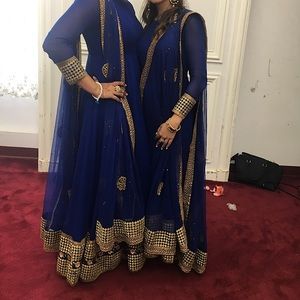 Blue suit with golden embr. Worn twice.